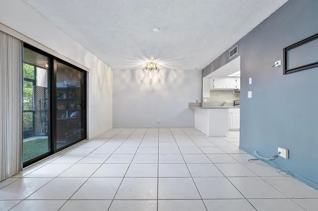 a view of a kitchen with a sink and a refrigerator window
