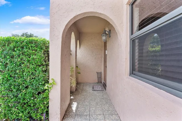a kitchen with stainless steel appliances kitchen island granite countertop a refrigerator and a stove top oven