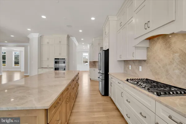 a kitchen with stainless steel appliances granite countertop a stove and a sink