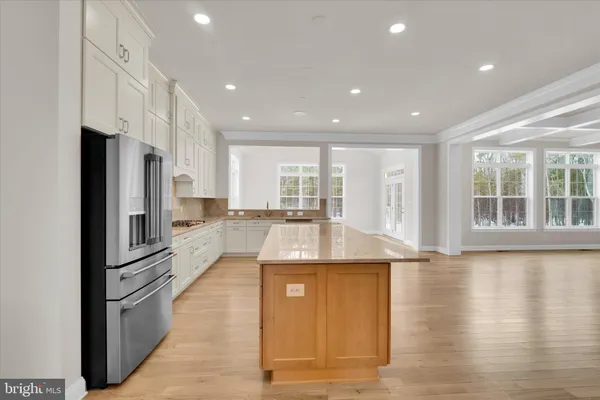 a view of a livingroom with a flat screen tv and floor to ceiling window