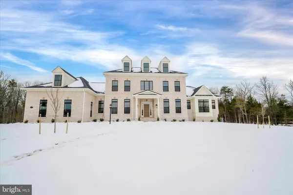 a view of a brick house with large windows