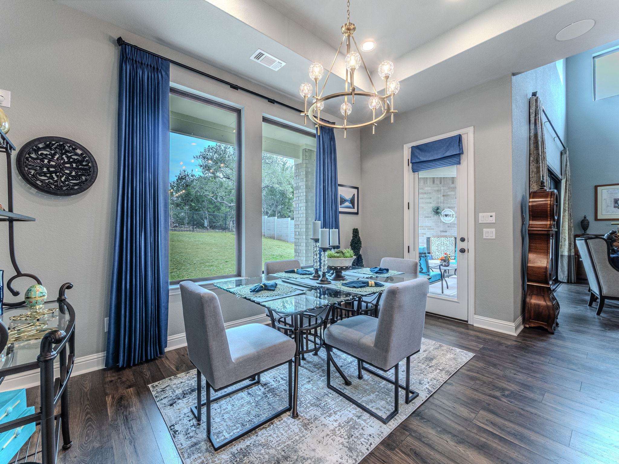 112 Hollytree Court Georgetown, TX 78628 - Photo 11 of 40 a view of a dining room with furniture wooden floor and chandelier