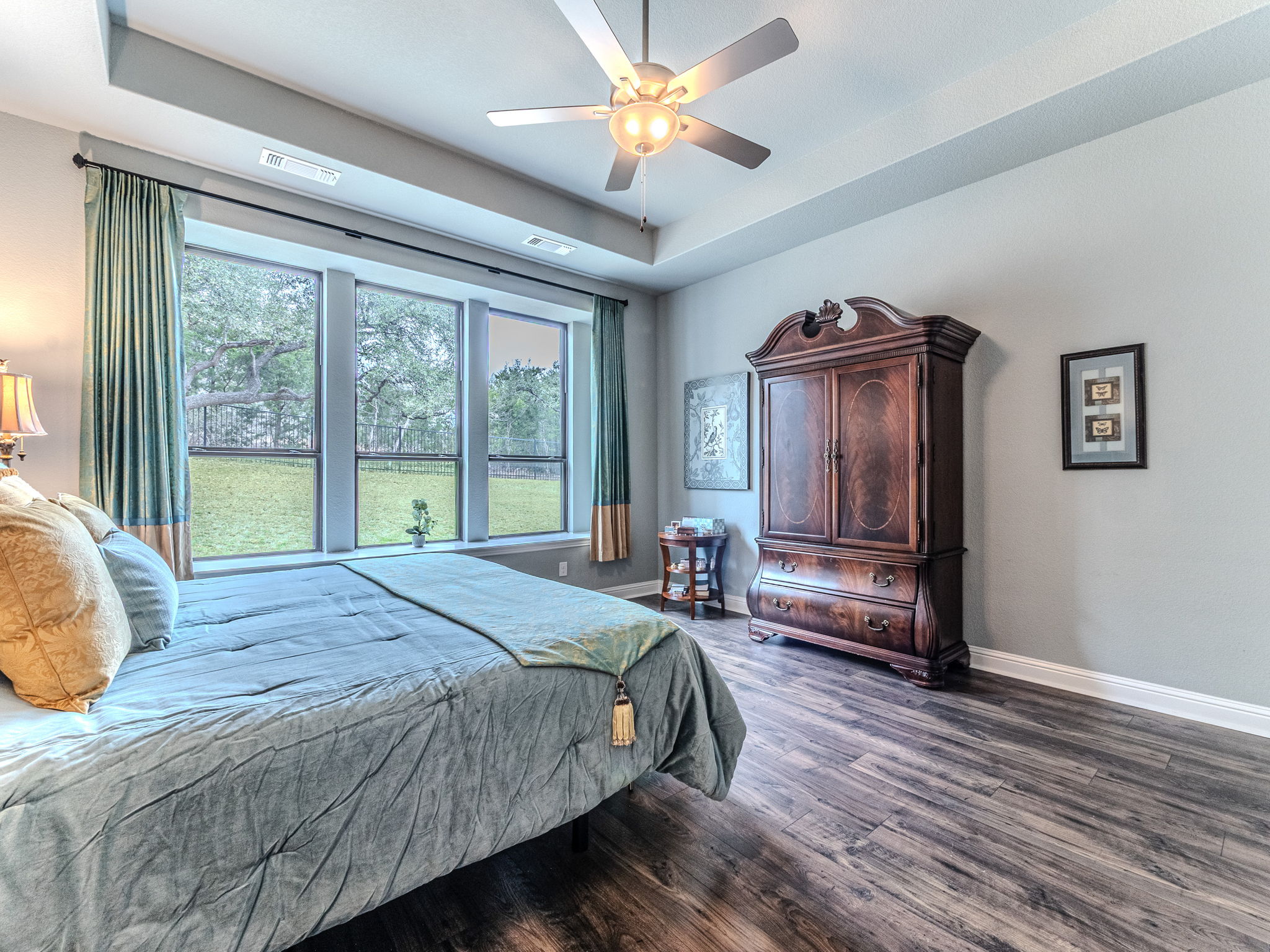 112 Hollytree Court Georgetown, TX 78628 - Photo 13 of 40 Bedroom with a raised ceiling, dark wood-style floors, and a ceiling fan