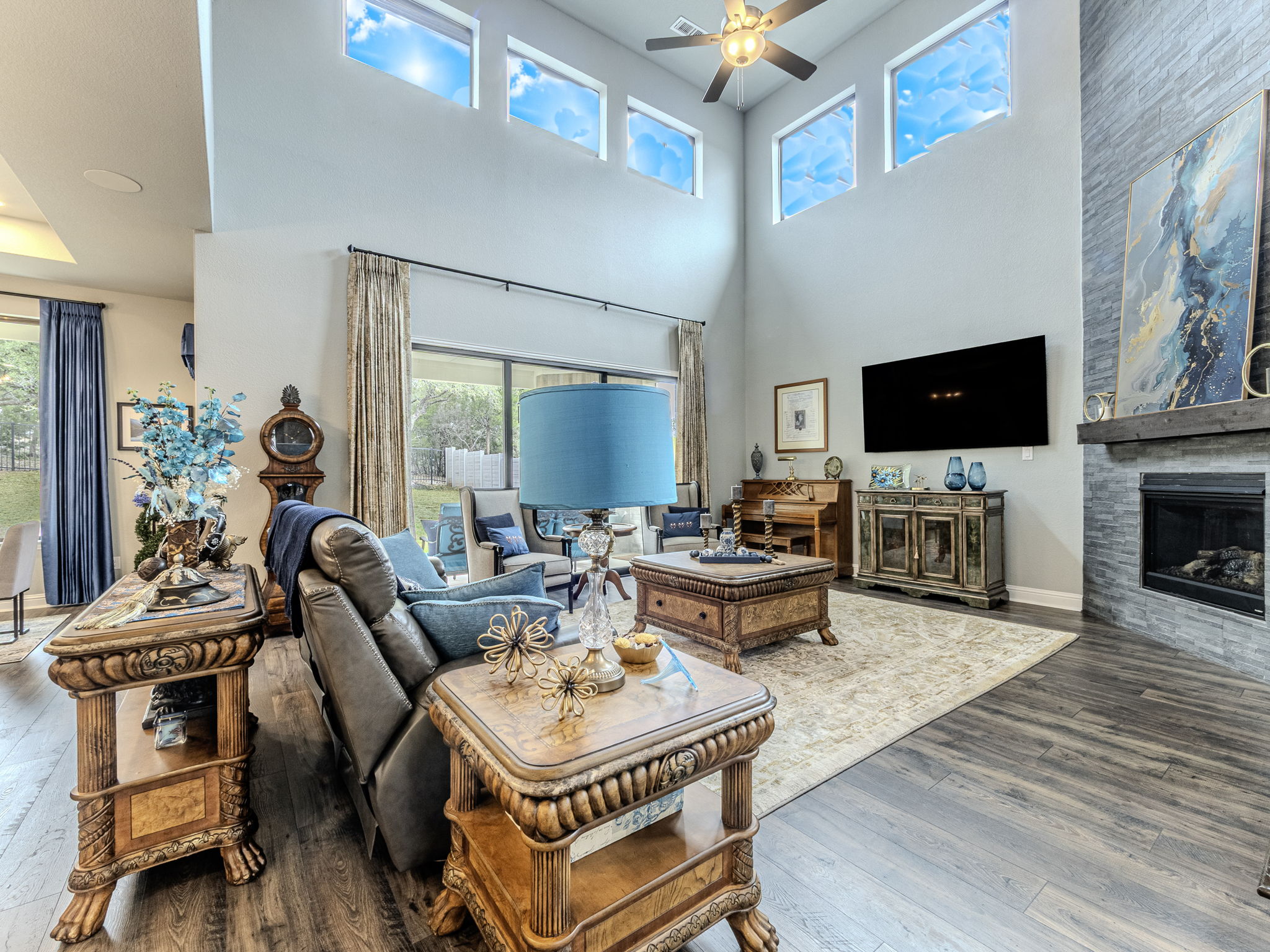 112 Hollytree Court Georgetown, TX 78628 - Photo 2 of 40 a living room with furniture a flat screen tv and a fireplace
