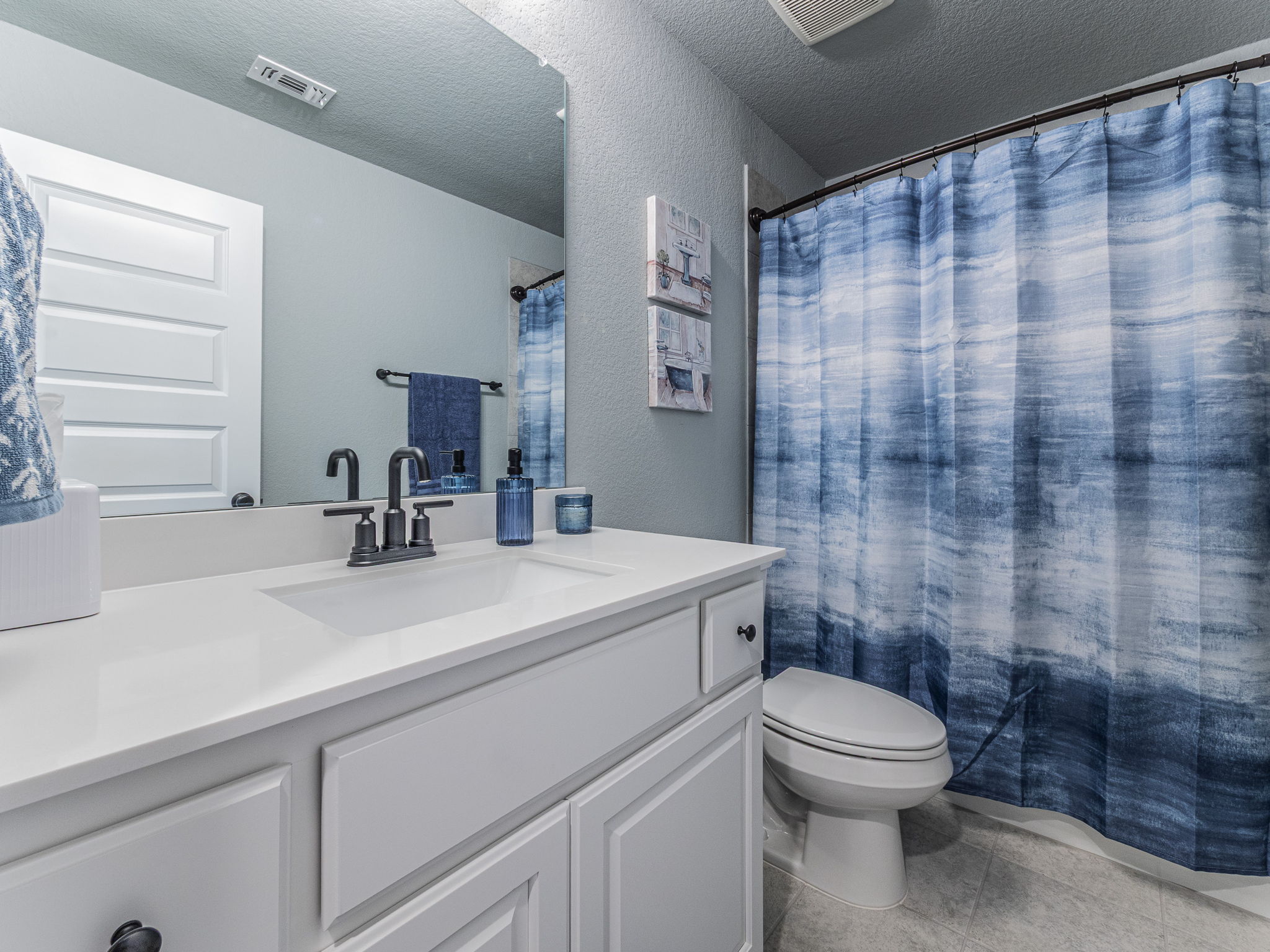 112 Hollytree Court Georgetown, TX 78628 - Photo 23 of 40 a bathroom with a sink a toilet and shower