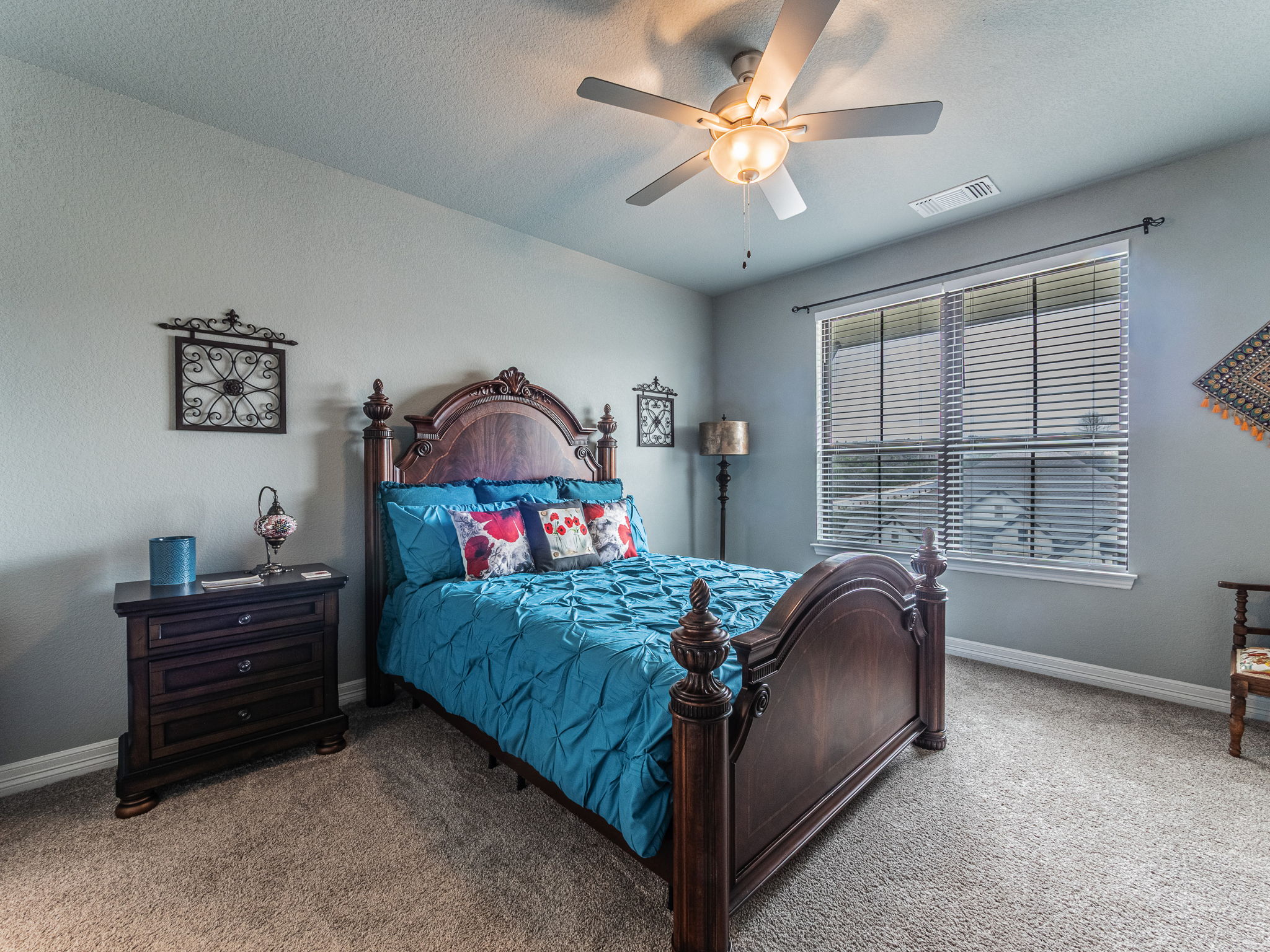 112 Hollytree Court Georgetown, TX 78628 - Photo 24 of 40 a bed room with a bed dresser and a window