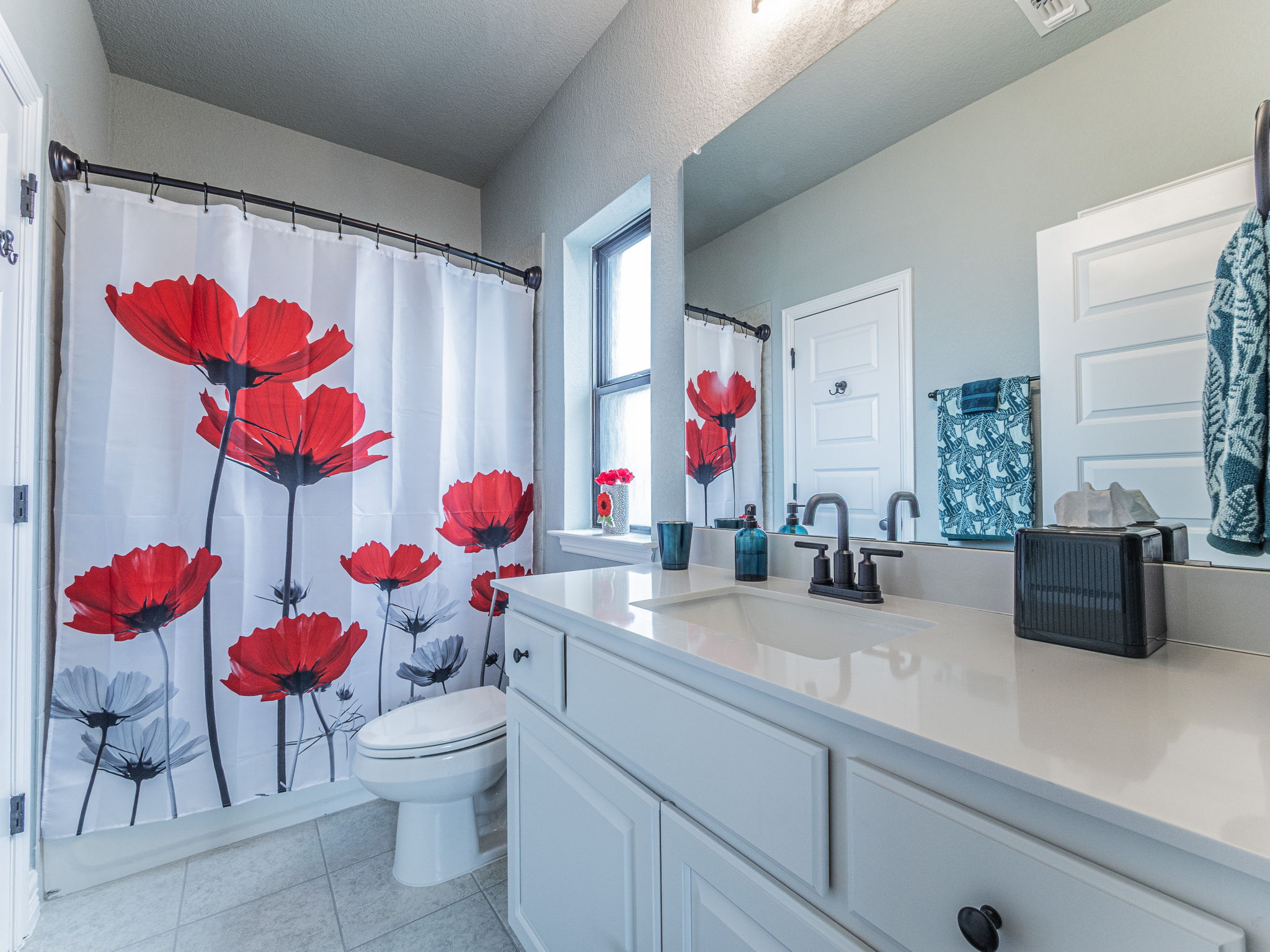 112 Hollytree Court Georgetown, TX 78628 - Photo 27 of 40 a bathroom with a sink mirror and vanity