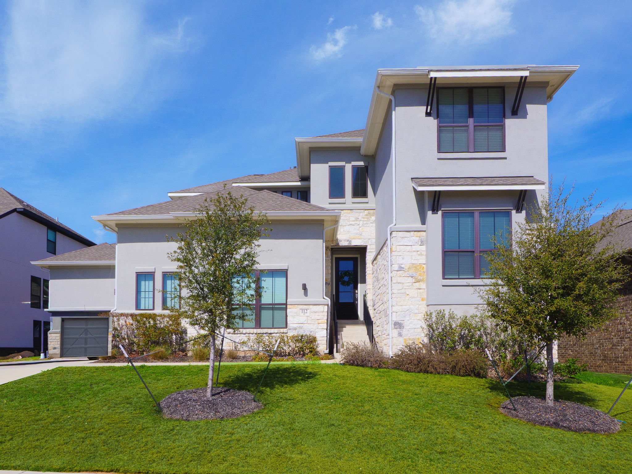 112 Hollytree Court Georgetown, TX 78628 - Photo 5 of 40 a front view of a house with a yard and garage