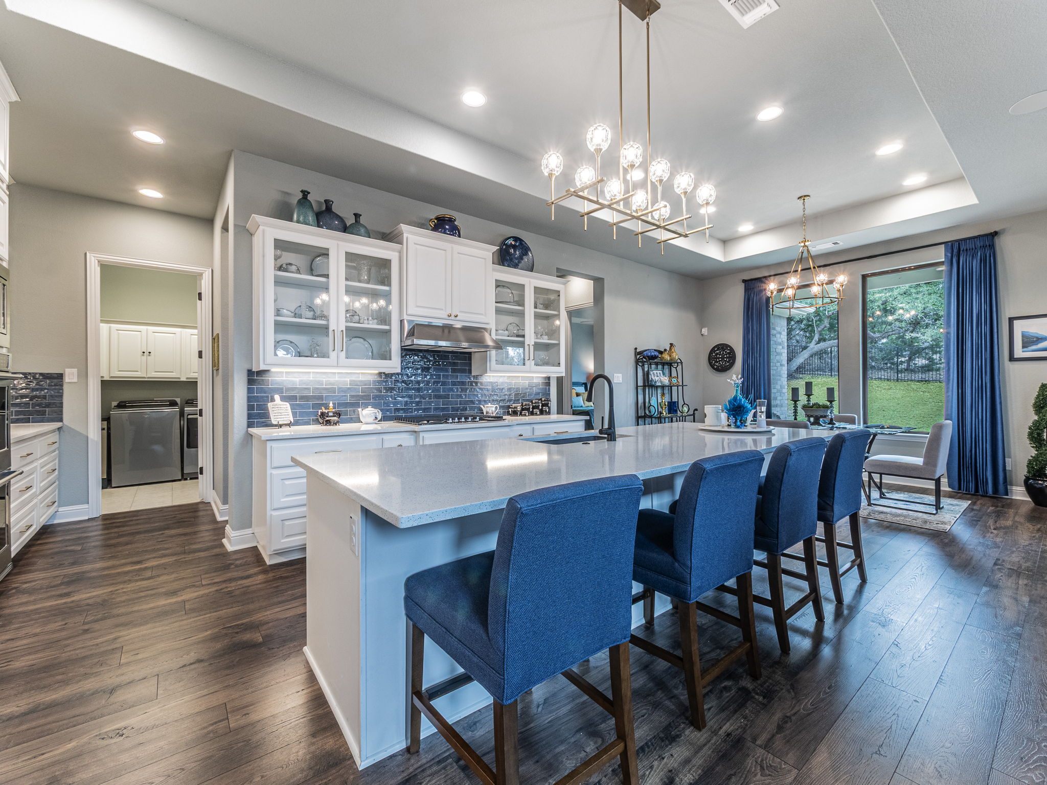 112 Hollytree Court Georgetown, TX 78628 - Photo 8 of 40 a kitchen with stainless steel appliances granite countertop a dining table chairs and granite counter tops