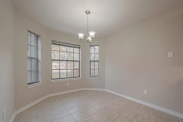 a large kitchen with stainless steel appliances granite countertop a sink and cabinets