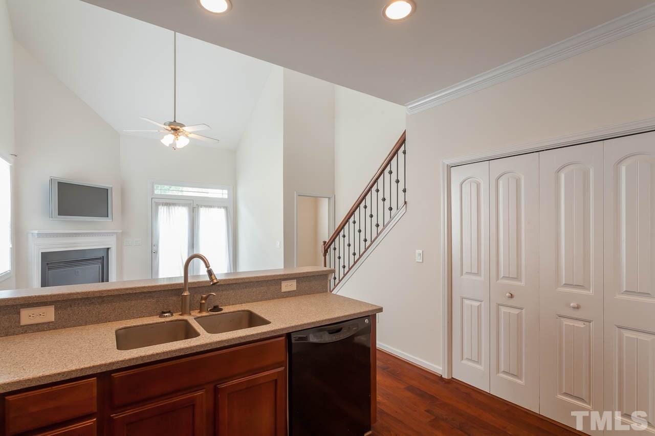 4708 Altha Street Raleigh, NC 27606 - Photo 11 of 25 a kitchen with a sink and a window