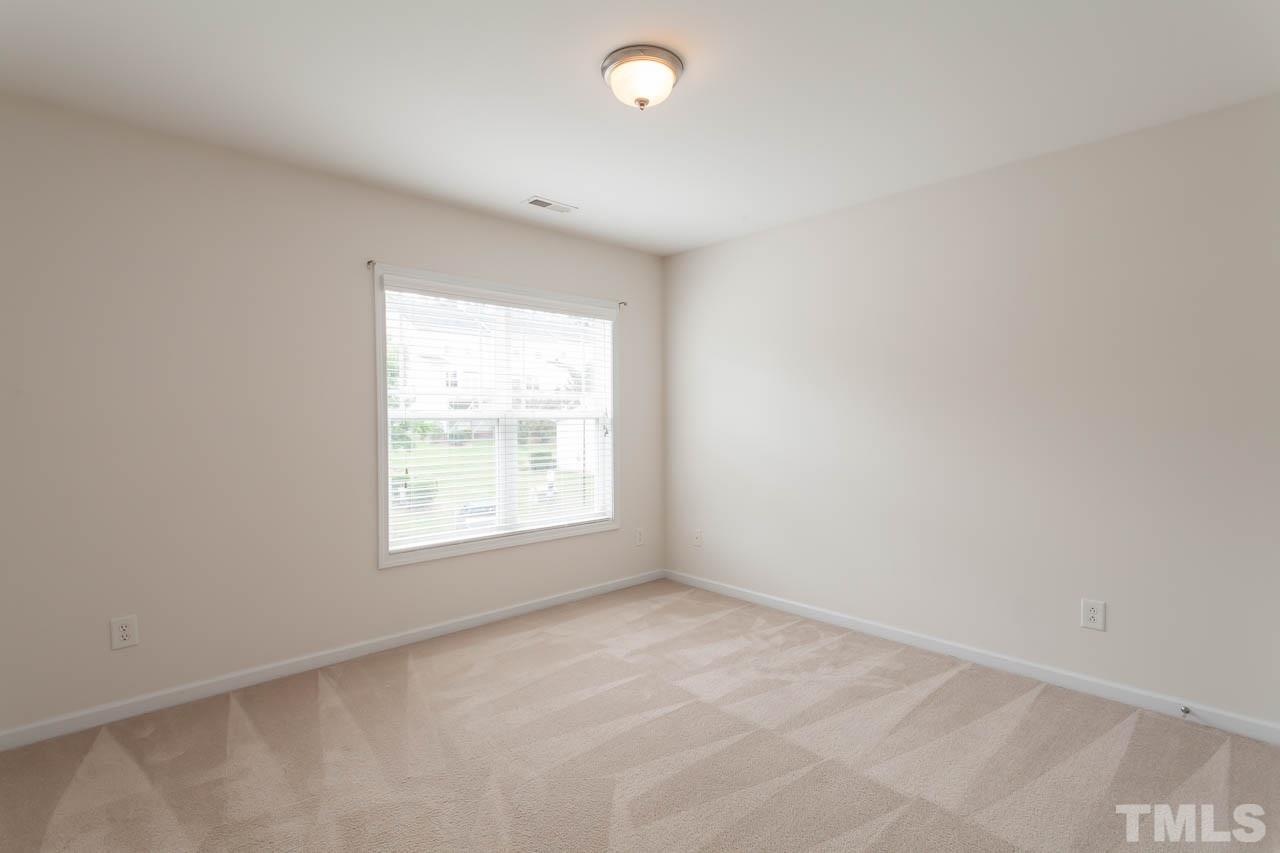 4708 Altha Street Raleigh, NC 27606 - Photo 24 of 25 an empty room with a window