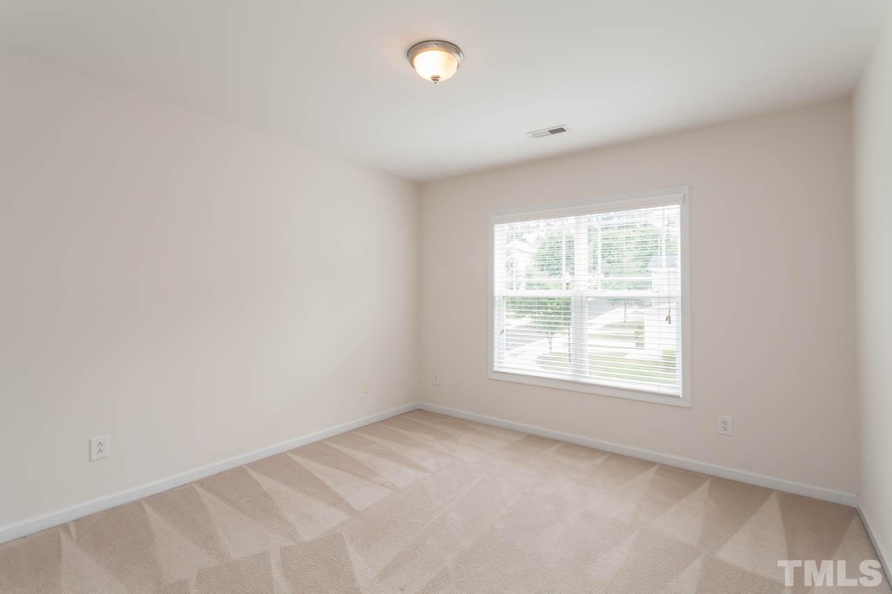 4708 Altha Street Raleigh, NC 27606 - Photo 25 of 25 an empty room with a window