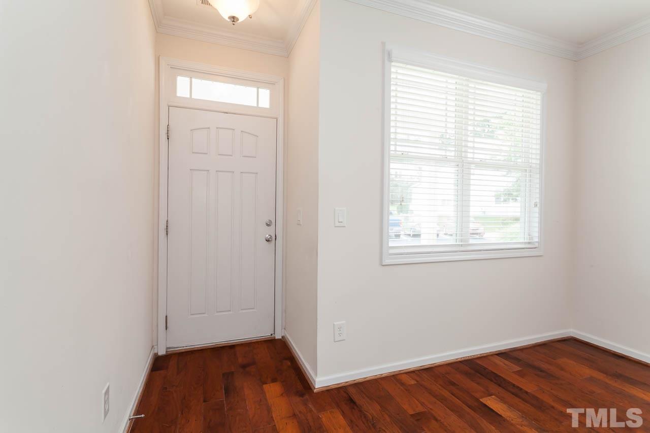 4708 Altha Street Raleigh, NC 27606 - Photo 5 of 25 wooden floor in an empty room with a window