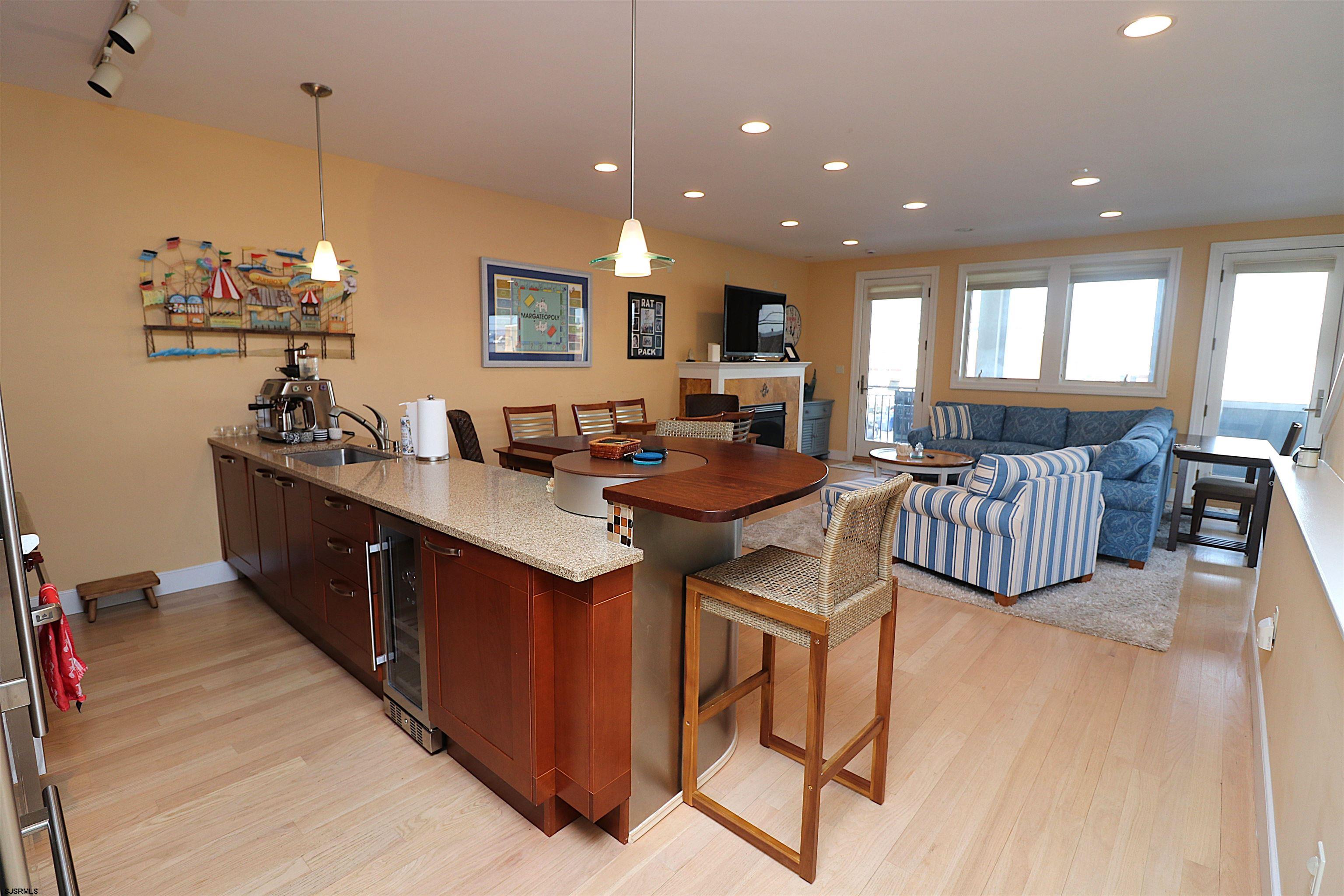 214 North Decatur Avenue, Unit B Margate City, NJ 08402 - Photo 13 of 23 a living room with lots of furniture and a chandelier