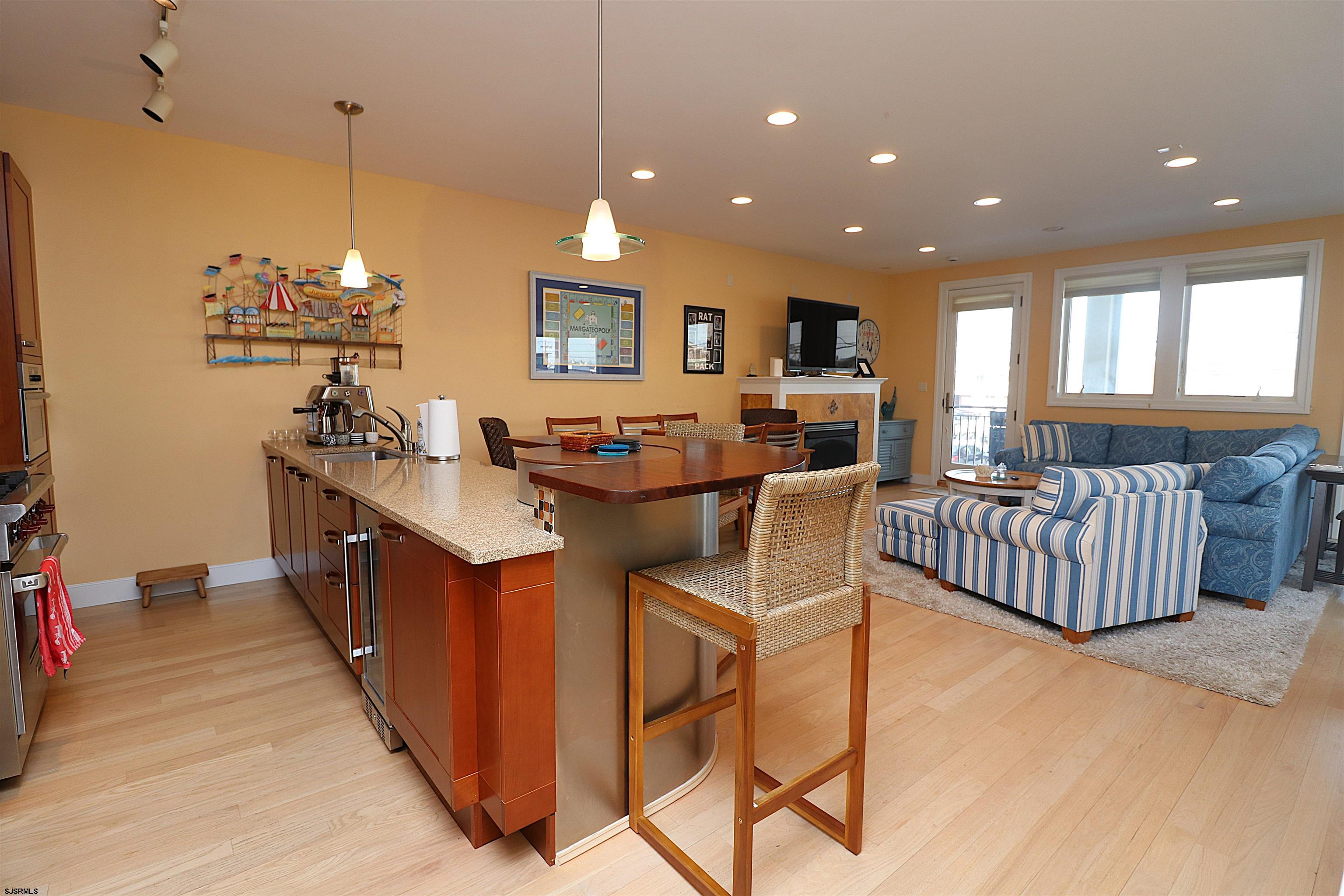 214 North Decatur Avenue, Unit B Margate City, NJ 08402 - Photo 14 of 23 a dining hall with stainless steel appliances granite countertop a sink a stove and a refrigerator