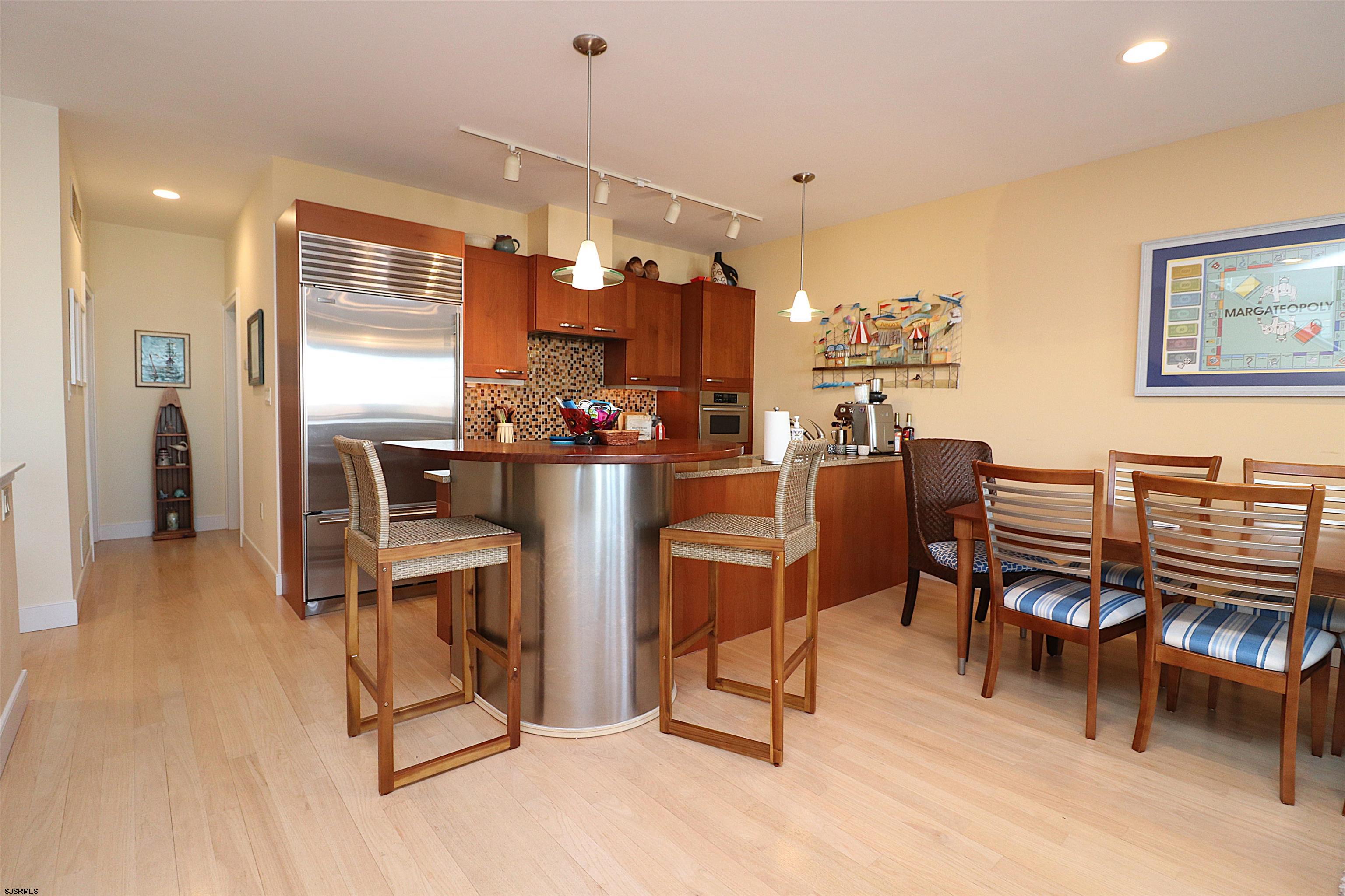 214 North Decatur Avenue, Unit B Margate City, NJ 08402 - Photo 15 of 23 a dining room with furniture and wooden floor