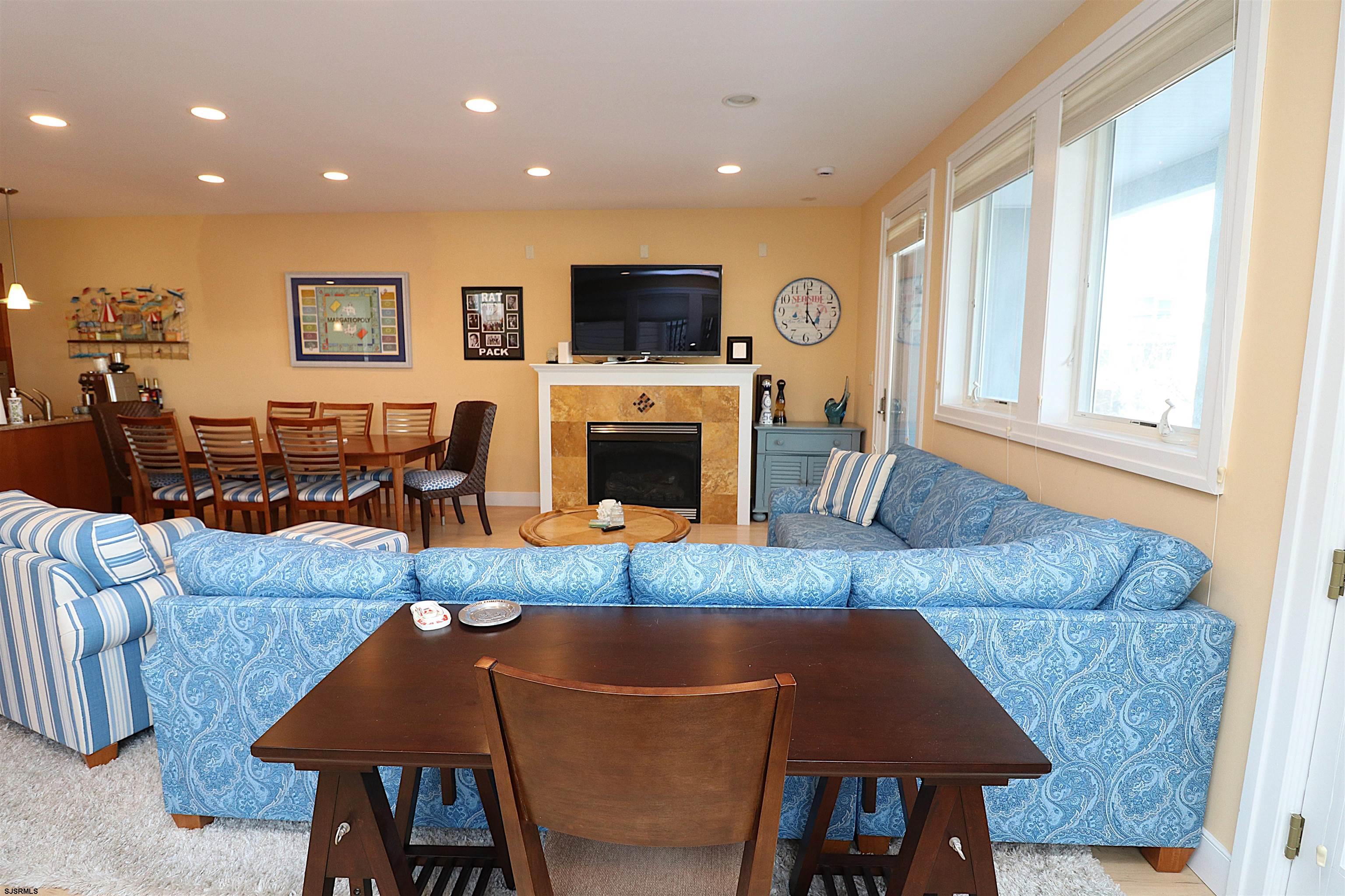 214 North Decatur Avenue, Unit B Margate City, NJ 08402 - Photo 21 of 23 a living room with fireplace furniture and a flat screen tv