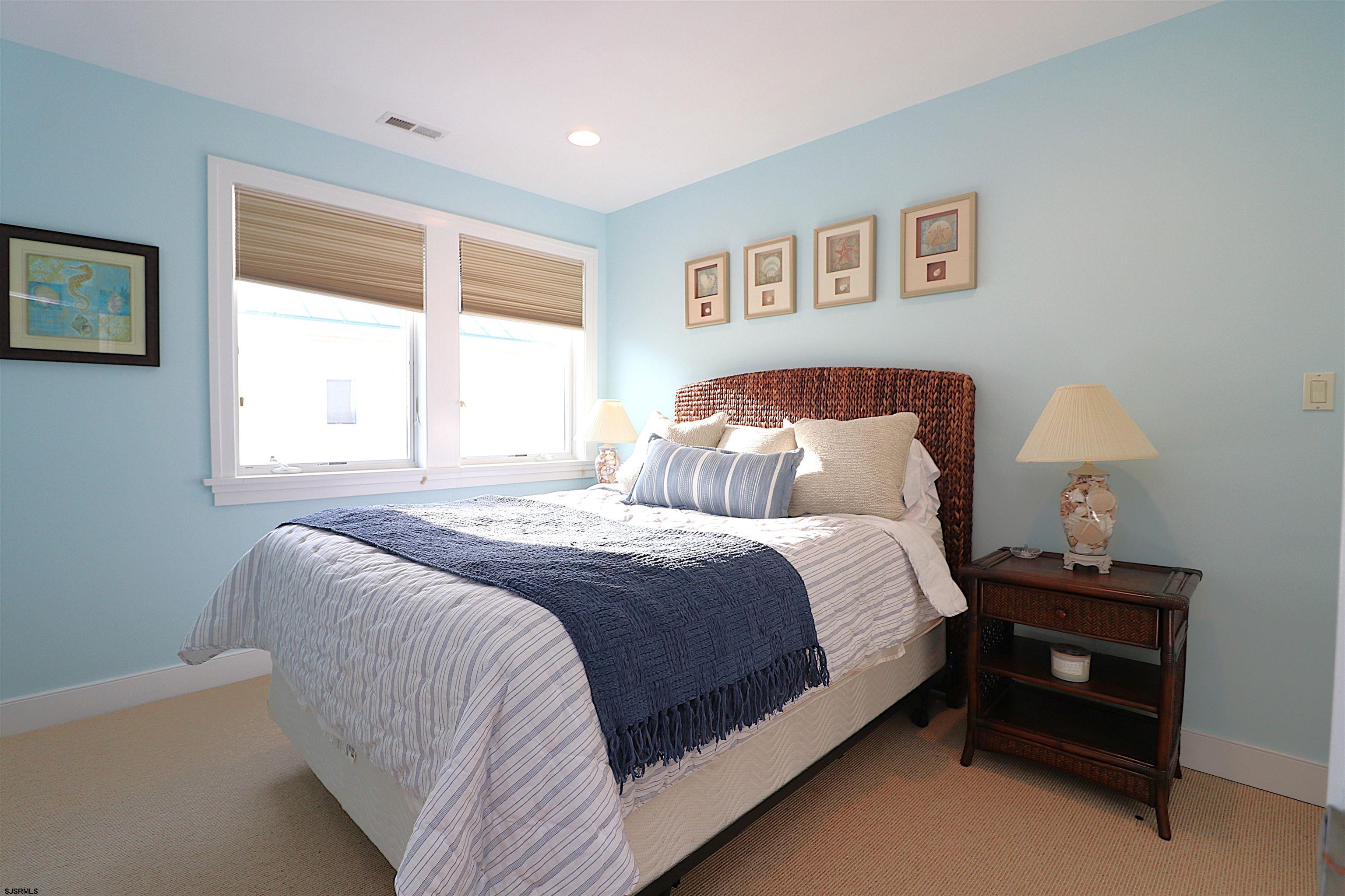 214 North Decatur Avenue, Unit B Margate City, NJ 08402 - Photo 23 of 23 a bedroom with a bed and a night stand