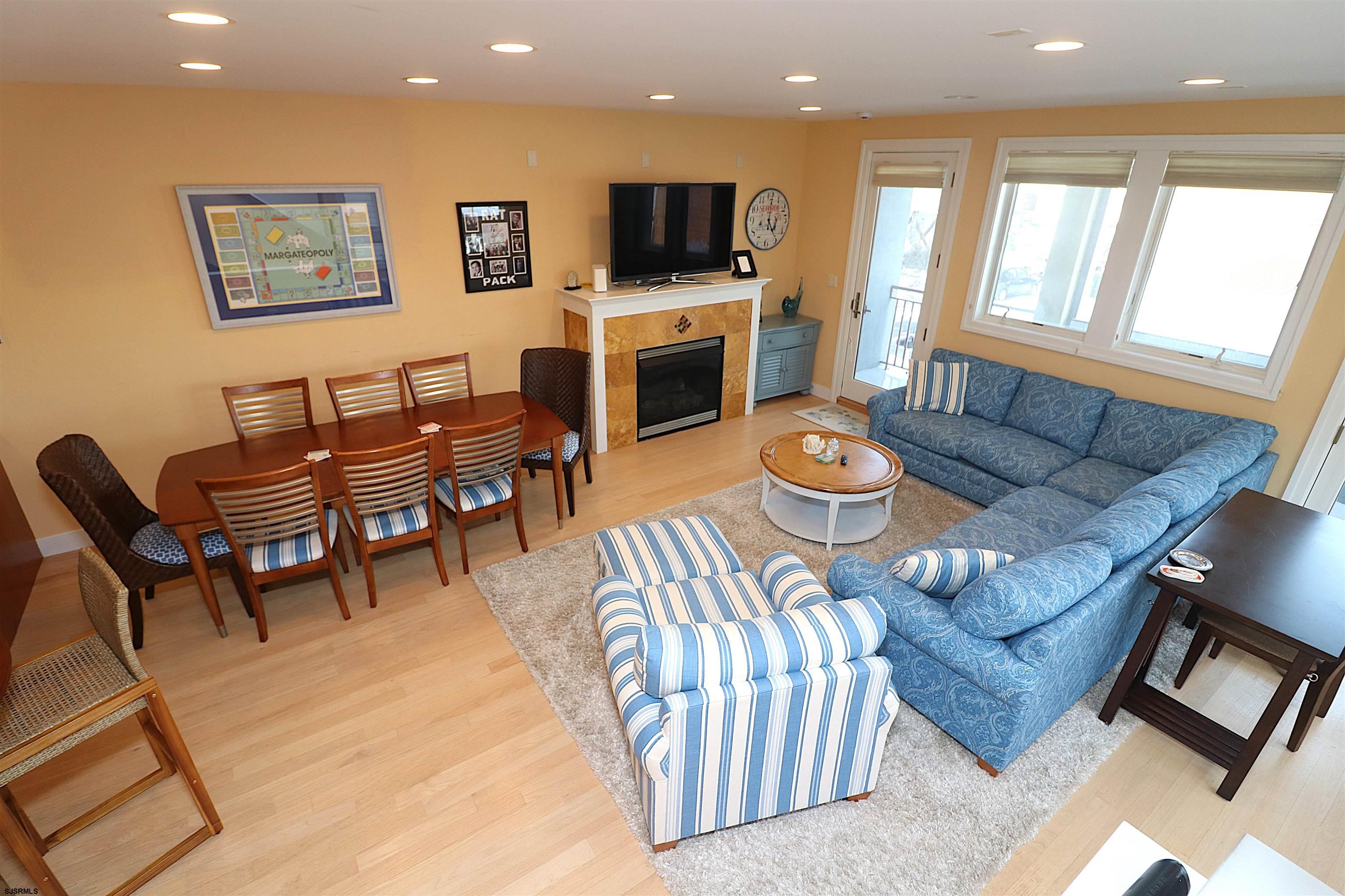 214 North Decatur Avenue, Unit B Margate City, NJ 08402 - Photo 3 of 23 a living room with furniture and a flat screen tv
