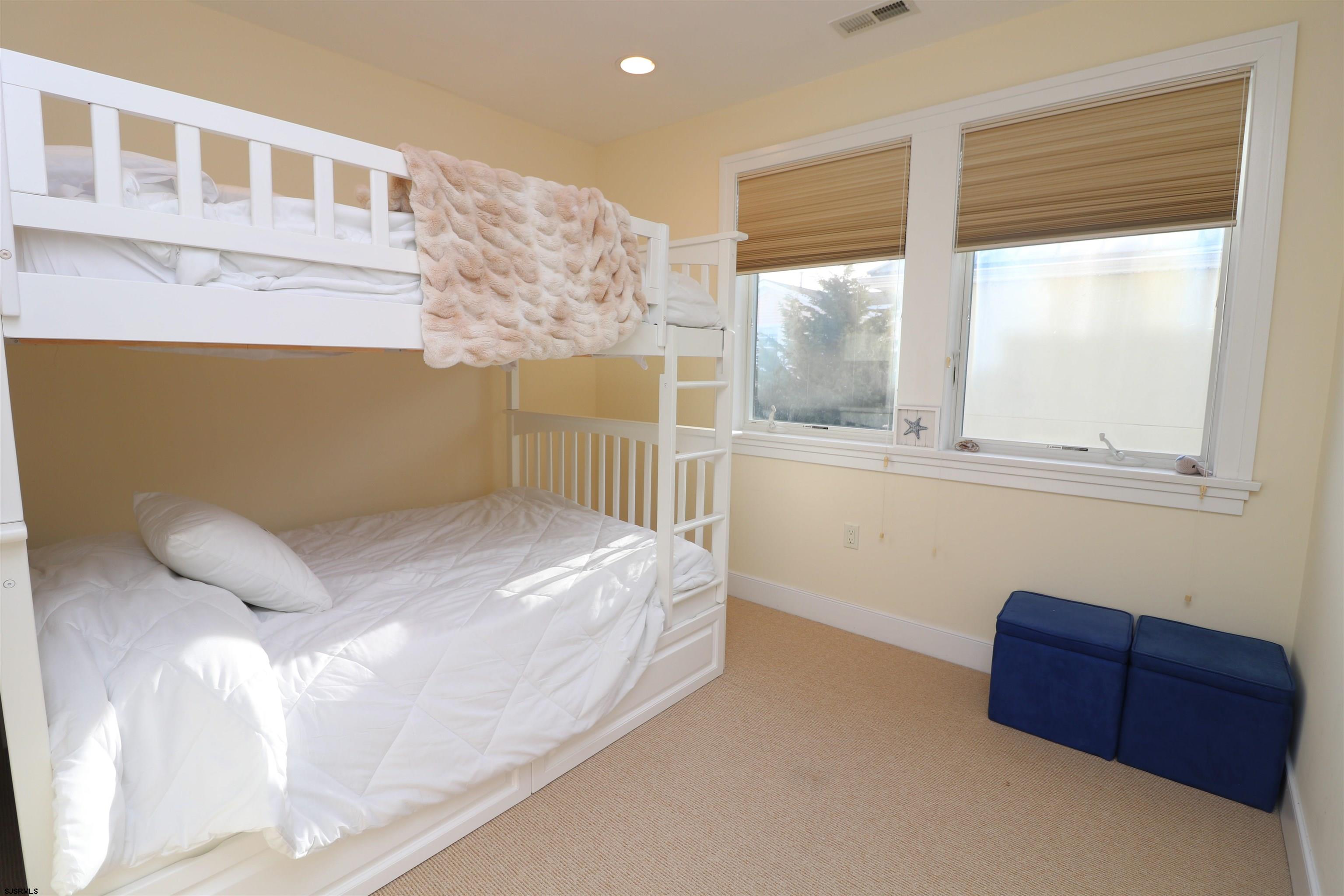 214 North Decatur Avenue, Unit B Margate City, NJ 08402 - Photo 8 of 23 a bedroom with a bed and a window