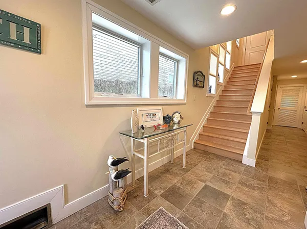 a dining room with wooden floor and a window