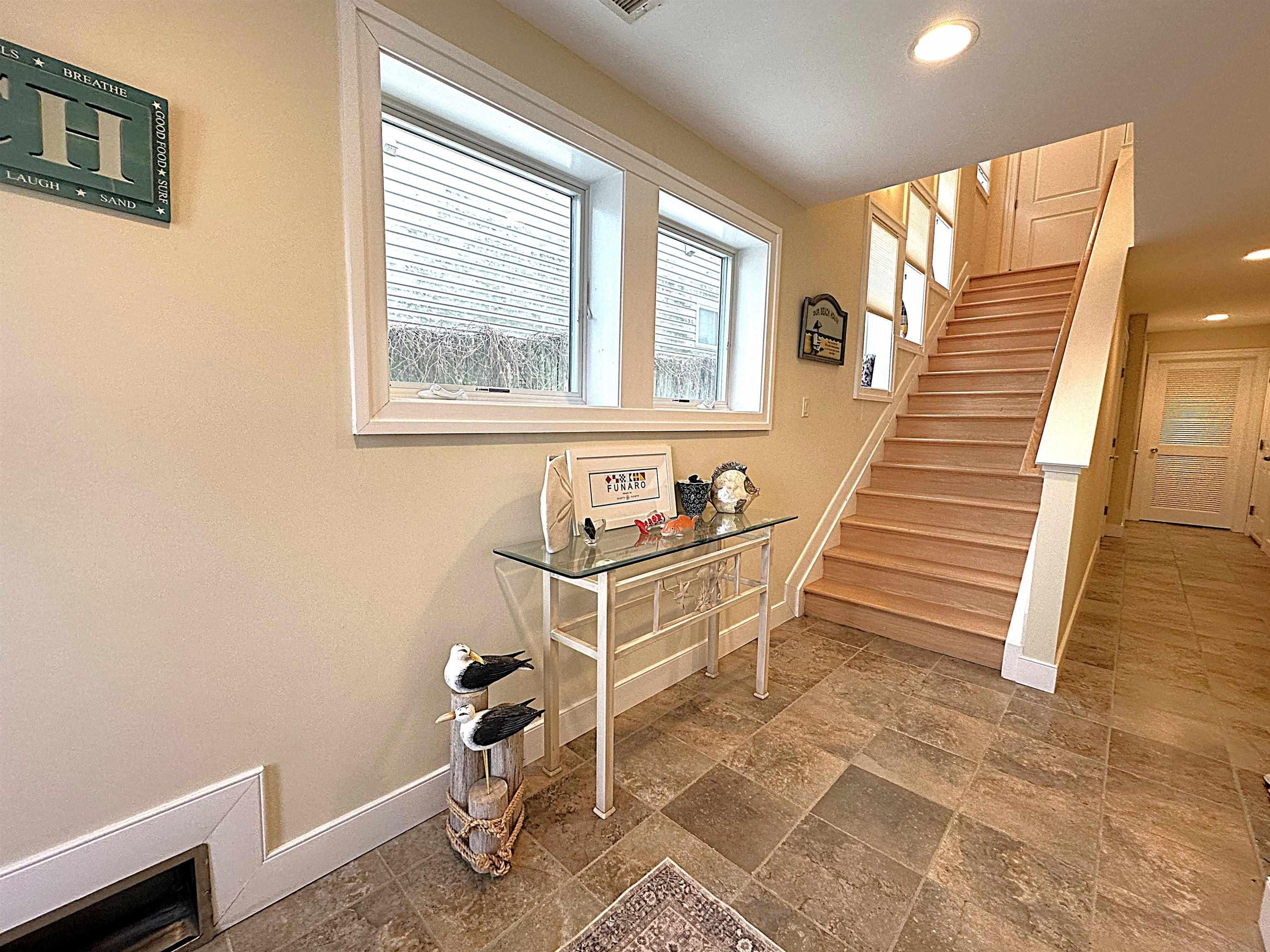 214 North Decatur Avenue, Unit B Margate City, NJ 08402 - Photo 9 of 23 a dining room with wooden floor and a window