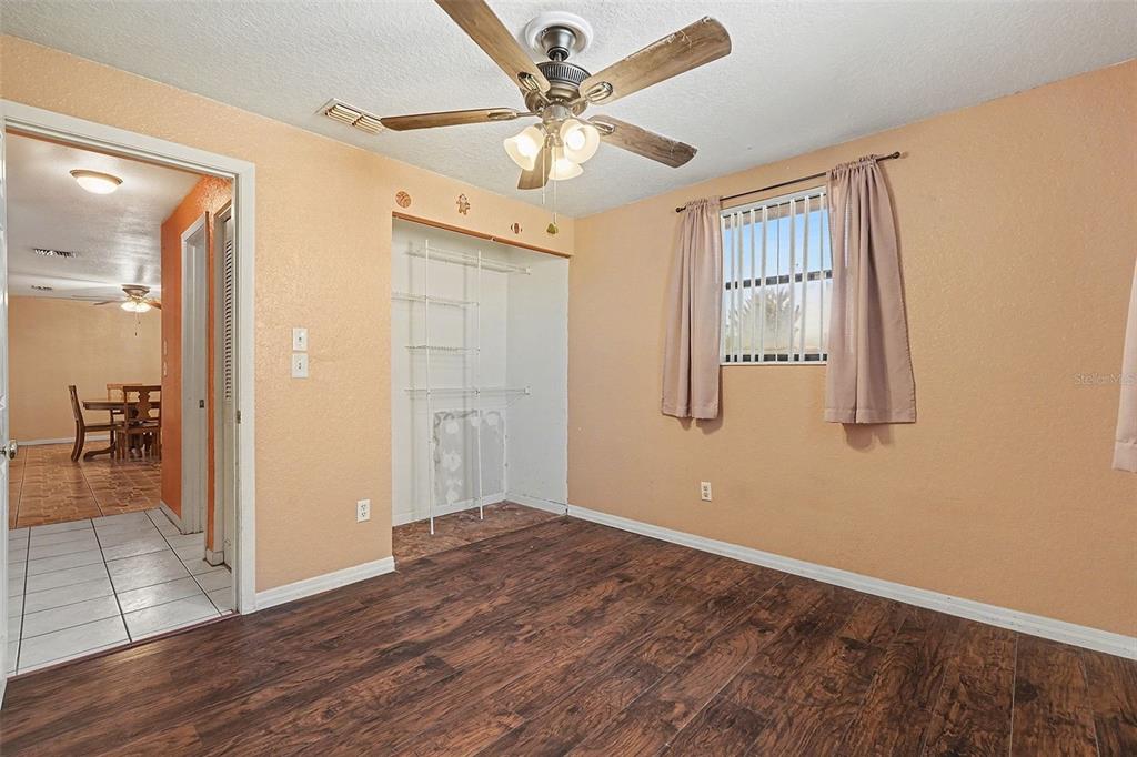 9528 River Road Spring Hill, FL 34608 - Photo 22 of 30 wooden floor in an empty room with a window