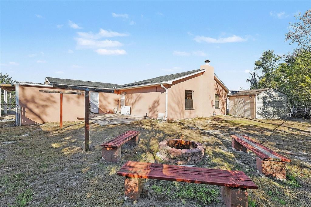 9528 River Road Spring Hill, FL 34608 - Photo 29 of 30 a view of house with backyard