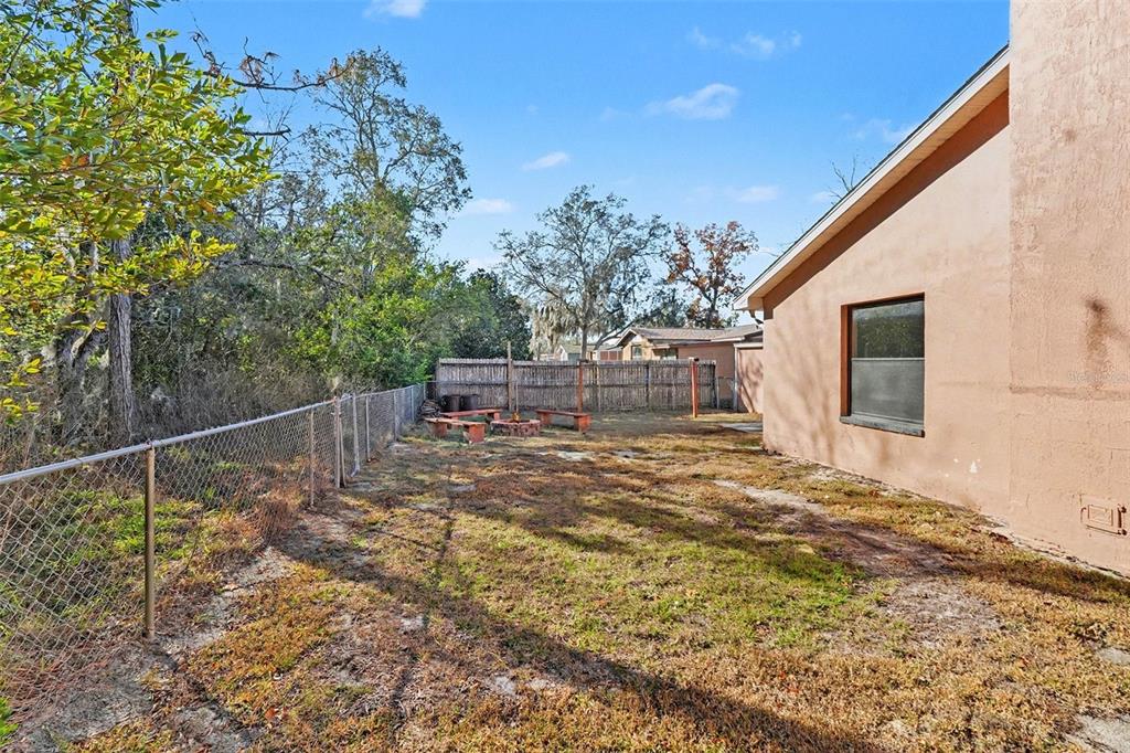 9528 River Road Spring Hill, FL 34608 - Photo 30 of 30 a view of a house with backyard and sitting area