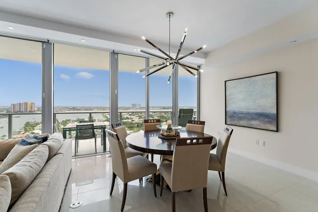 a view of a dining room with furniture window and outside view