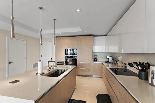 a kitchen with counter top space a sink and cabinets