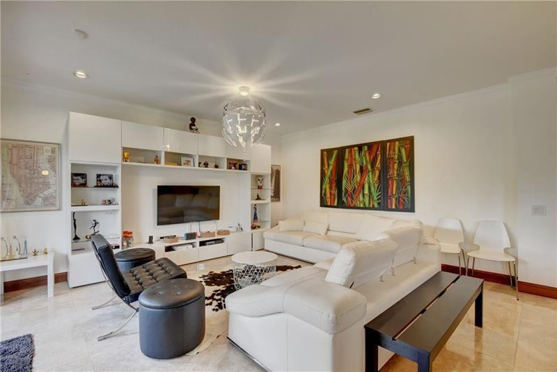 3863 Falcon Ridge Circle Weston, FL 33331 - Photo 19 of 52 a living room with furniture and a flat screen tv