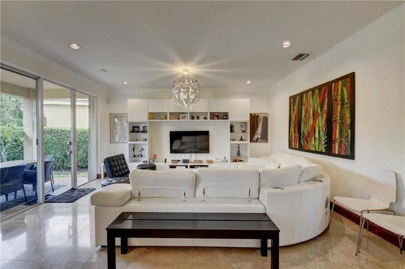 3863 Falcon Ridge Circle Weston, FL 33331 - Photo 2 of 52 a living room with fireplace furniture and a large window