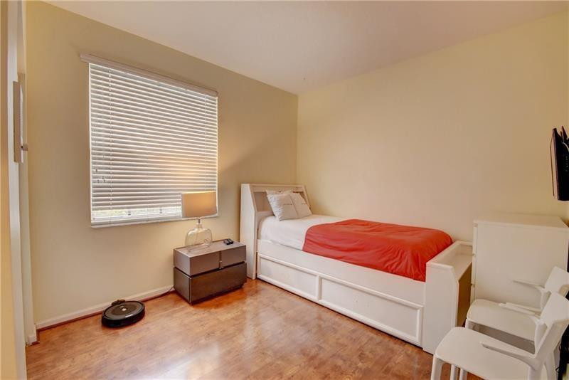 3863 Falcon Ridge Circle Weston, FL 33331 - Photo 26 of 52 a bedroom with a bed and a window