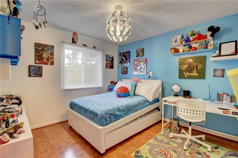 3863 Falcon Ridge Circle Weston, FL 33331 - Photo 30 of 52 a bedroom with a bed and window