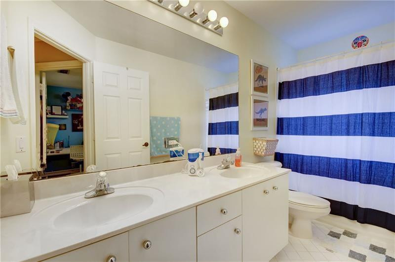 3863 Falcon Ridge Circle Weston, FL 33331 - Photo 31 of 52 a bathroom with a sink a toilet and shower