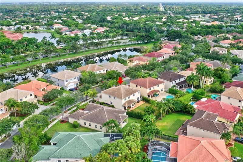 3863 Falcon Ridge Circle Weston, FL 33331 - Photo 42 of 52 an aerial view of residential houses with outdoor space and river