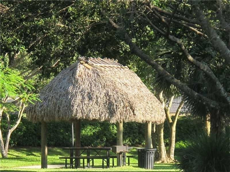3863 Falcon Ridge Circle Weston, FL 33331 - Photo 50 of 52 a view of backyard with tree
