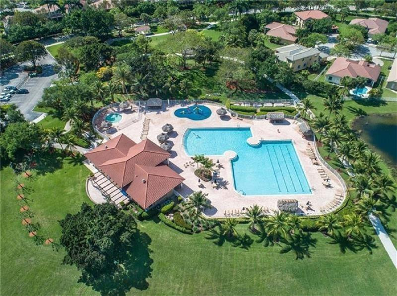 3863 Falcon Ridge Circle Weston, FL 33331 - Photo 51 of 52 an aerial view of a house
