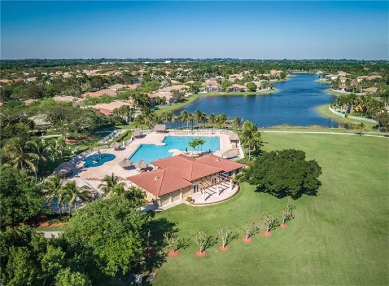 3863 Falcon Ridge Circle Weston, FL 33331 - Photo 6 of 52 an aerial view of residential houses with outdoor space