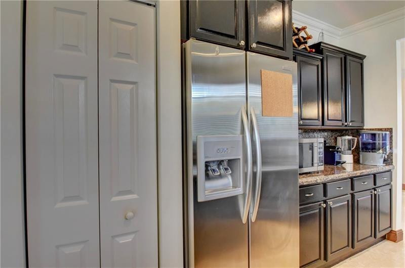 3863 Falcon Ridge Circle Weston, FL 33331 - Photo 8 of 52 a kitchen with stainless steel appliances cabinets and a refrigerator