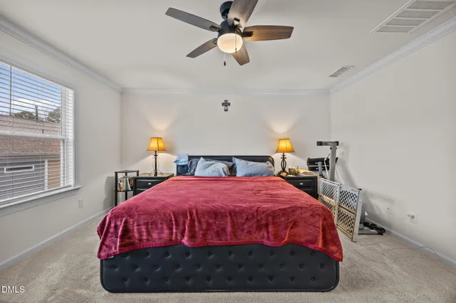 a bedroom with a bed and window