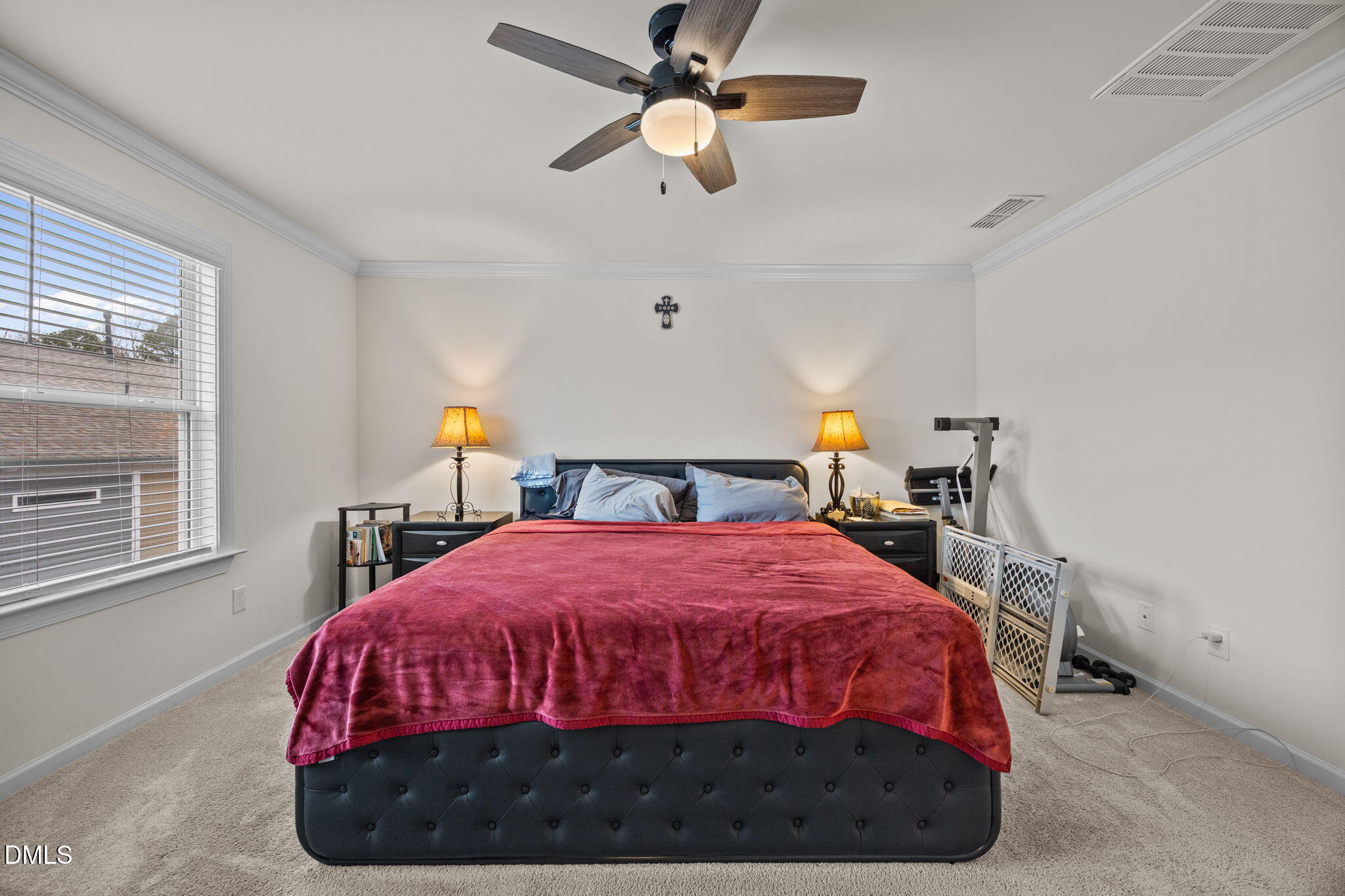 7015 Gentle Pine Place Raleigh, NC 27613 - Photo 20 of 41 a bedroom with a bed and window