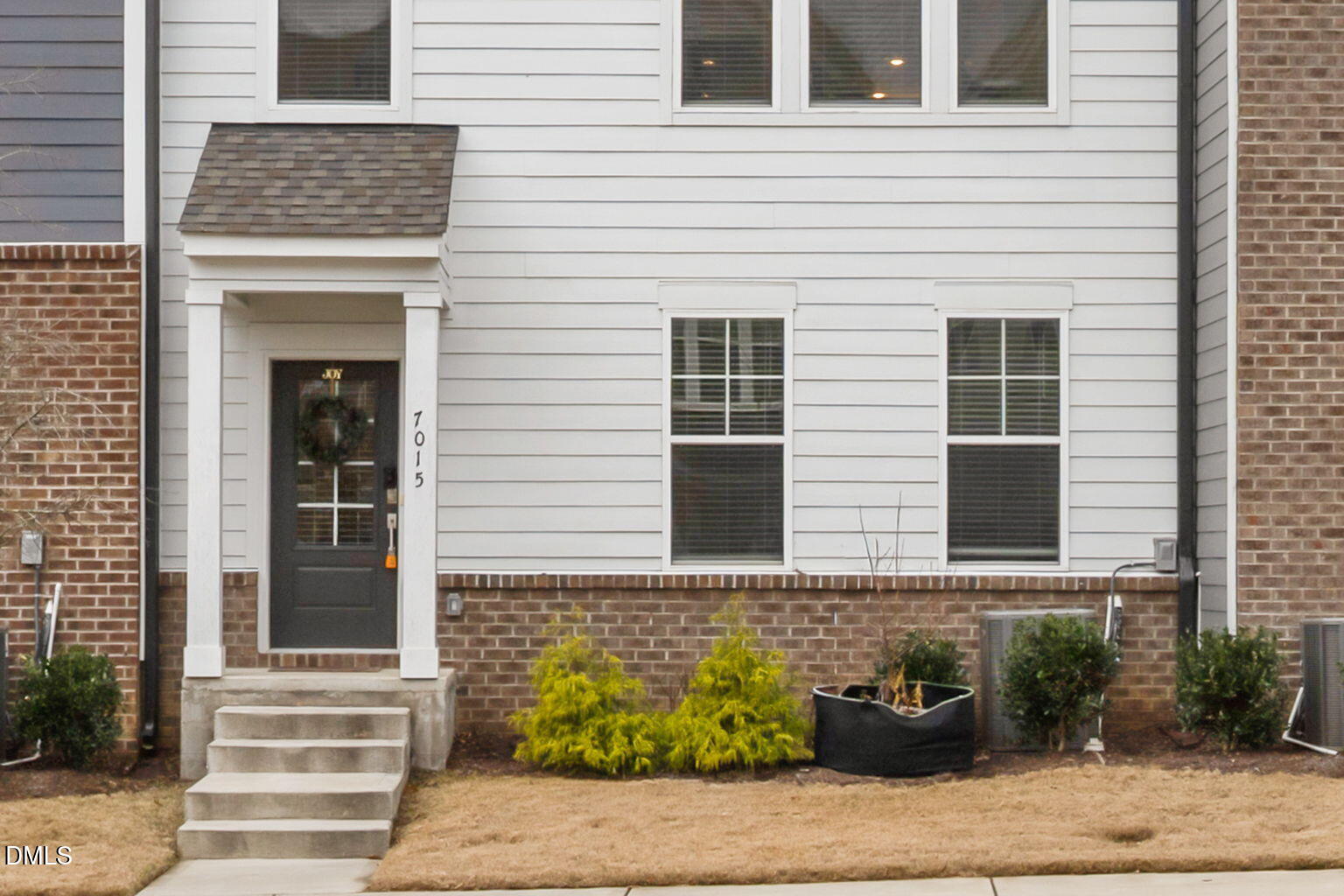 7015 Gentle Pine Place Raleigh, NC 27613 - Photo 3 of 41 a front view of a house