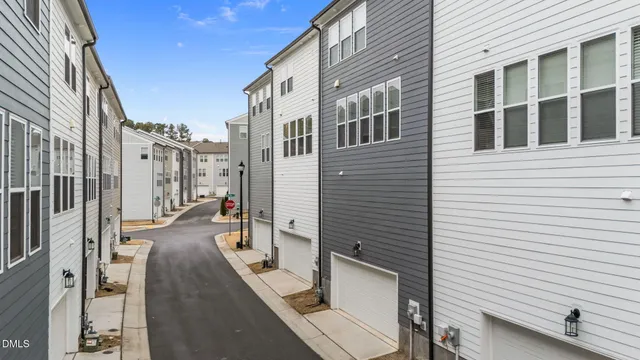 a view of a patio with couches chairs and potted plants