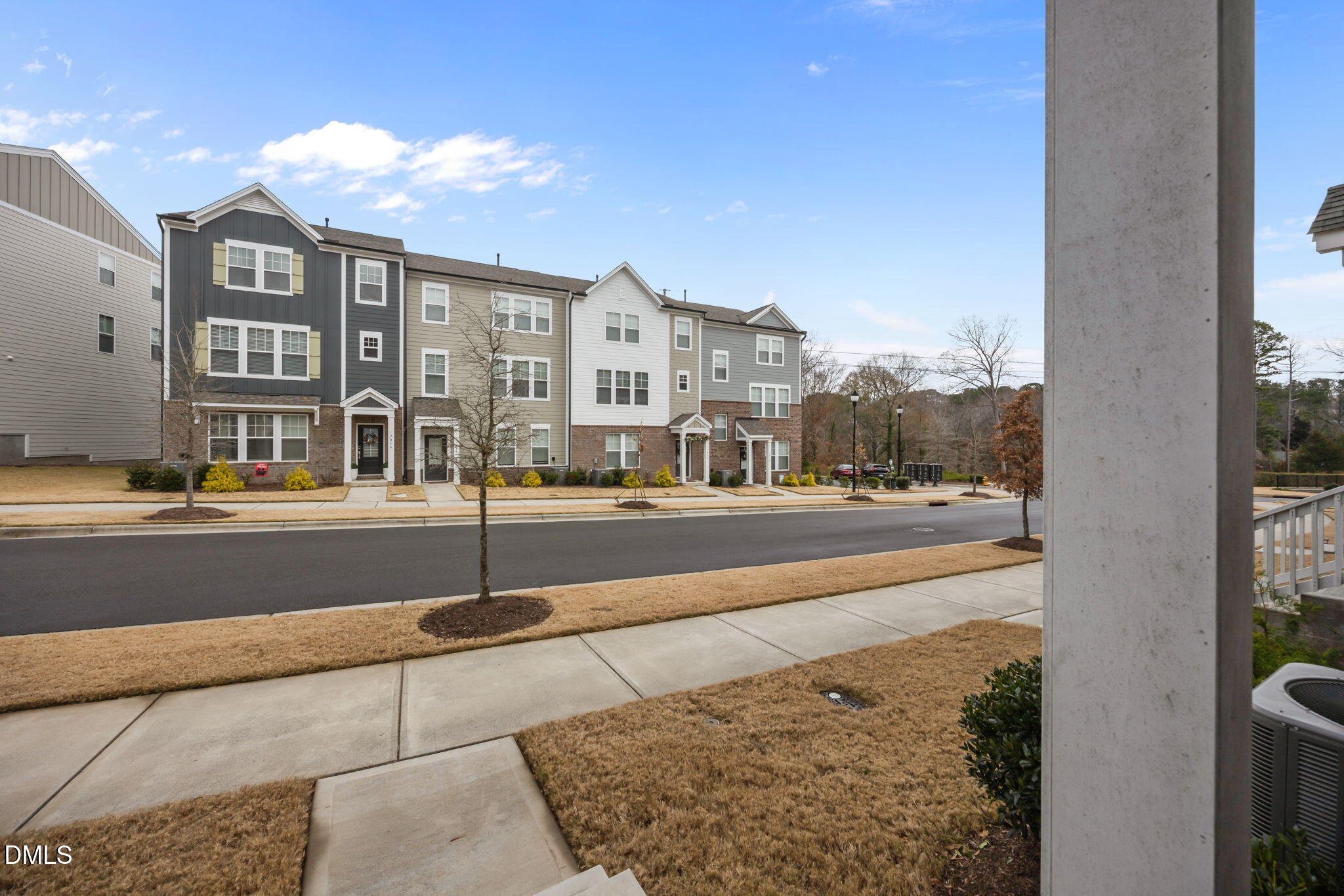 7015 Gentle Pine Place Raleigh, NC 27613 - Photo 34 of 41 a city view with tall buildings and a street sign on a street
