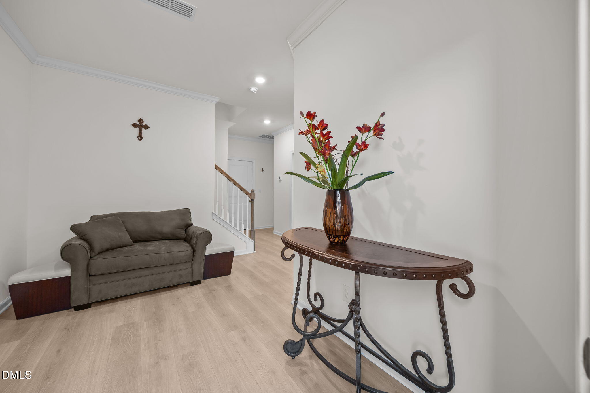 7015 Gentle Pine Place Raleigh, NC 27613 - Photo 4 of 41 a living room with furniture potted plant and a window