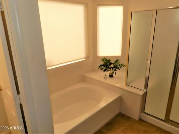 a bath tub sitting next to a window