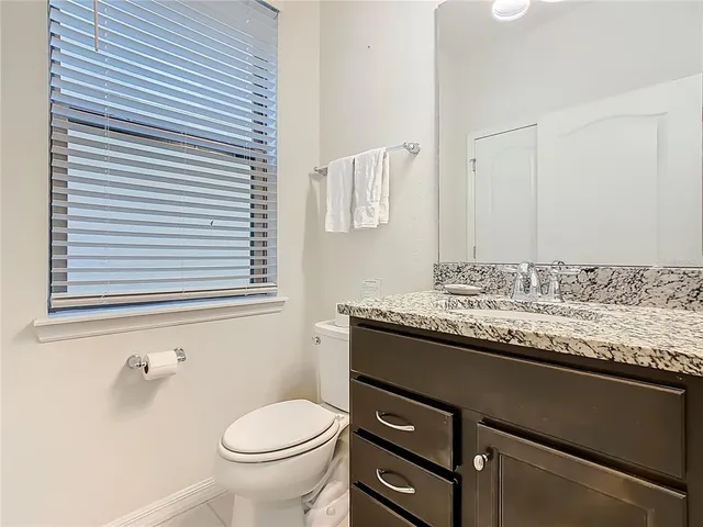 a bathroom with a shower and a toilet